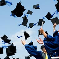 graduates throwing caps