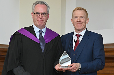 Adam Henson presenting an award