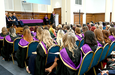 Jacqui Garret welcoming graduates to ceremony